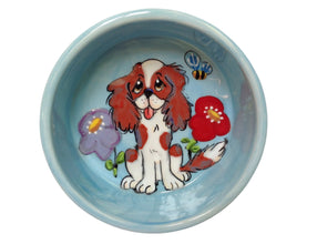 Cavalier King Charles Spaniel in the spring flowers