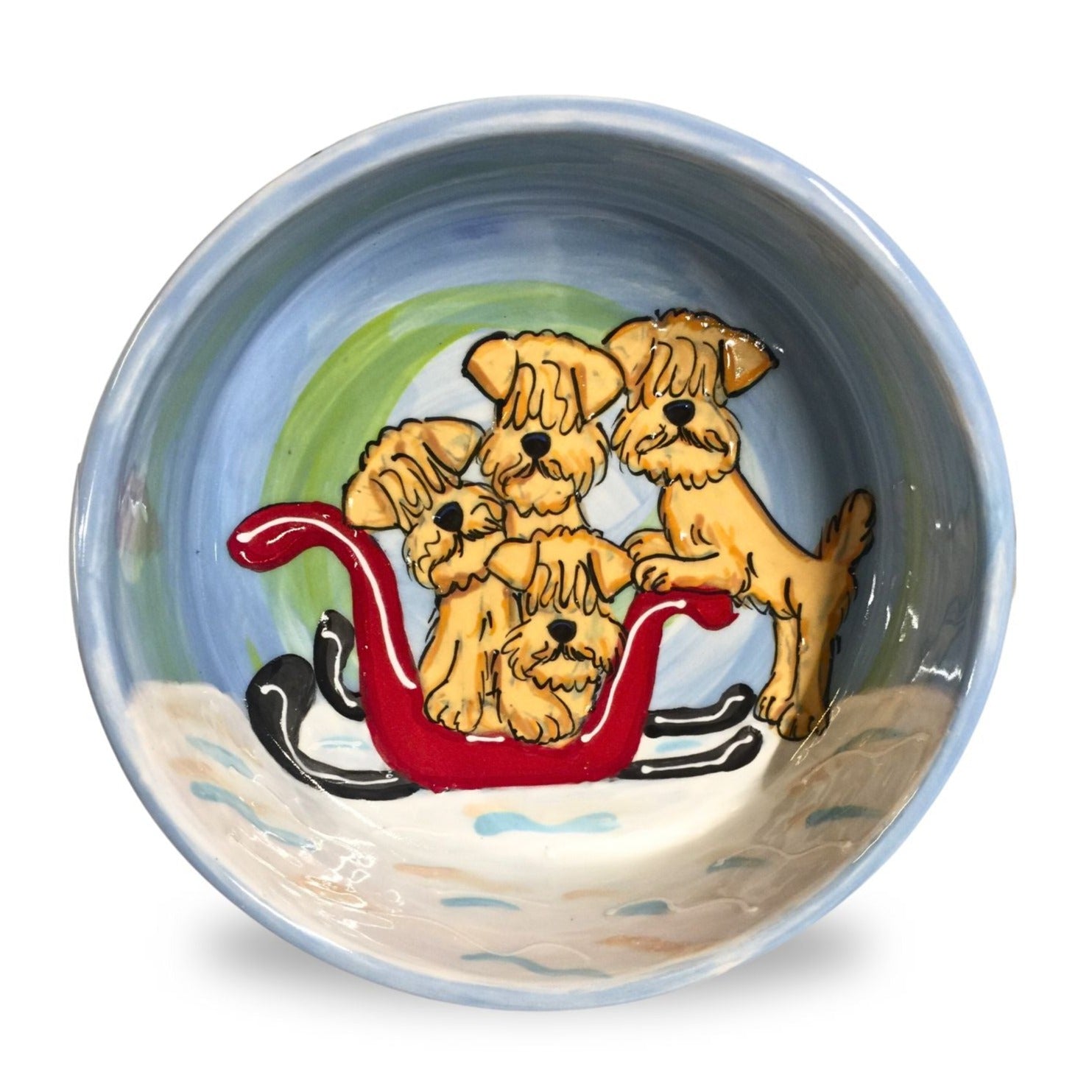 Hand-painted ceramic dog bowl with Wheaten Terrier sleigh ride design by Debby Carman