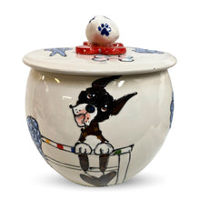 Custom hand-painted ceramic treat jar featuring a playful dog portrait with bone and paw design - food safe by Faux Paw.