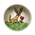 A hand-painted ceramic bowl featuring an adorable Chihuahua illustration with a heart, set against a lush green grass background, perfect for personalization