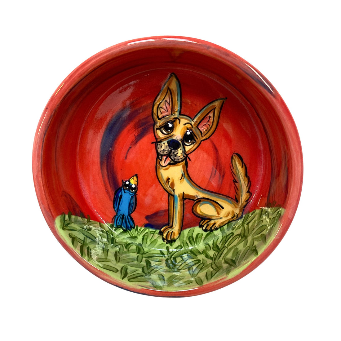 Hand-painted red ceramic bowl with a cheerful Chihuahua and a blue bird on a green grassy background, customizable with a pet&