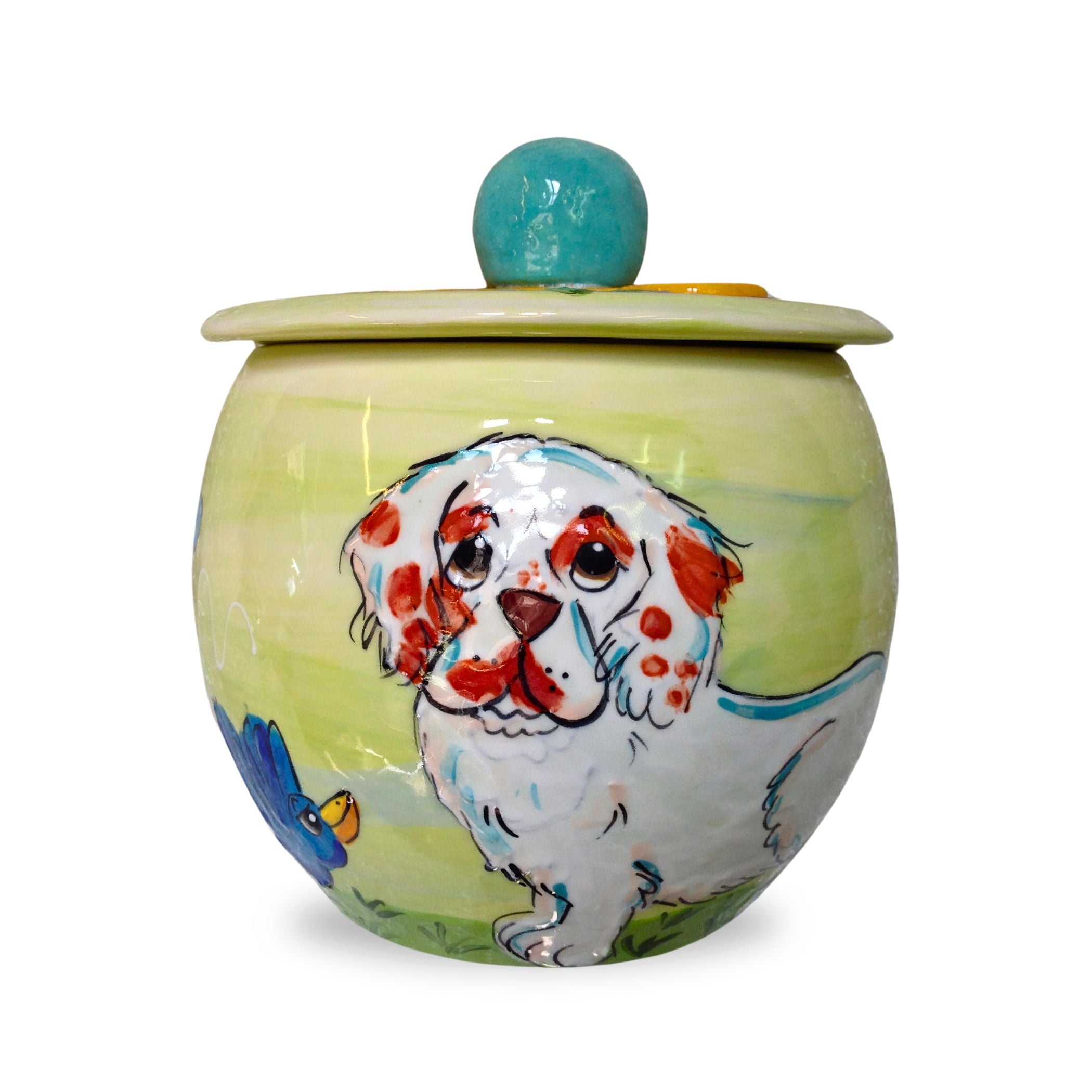 Side view of Clumber Spaniel ceramic food-safe jar with a playful bird illustration, hand-painted by Debby Carman.