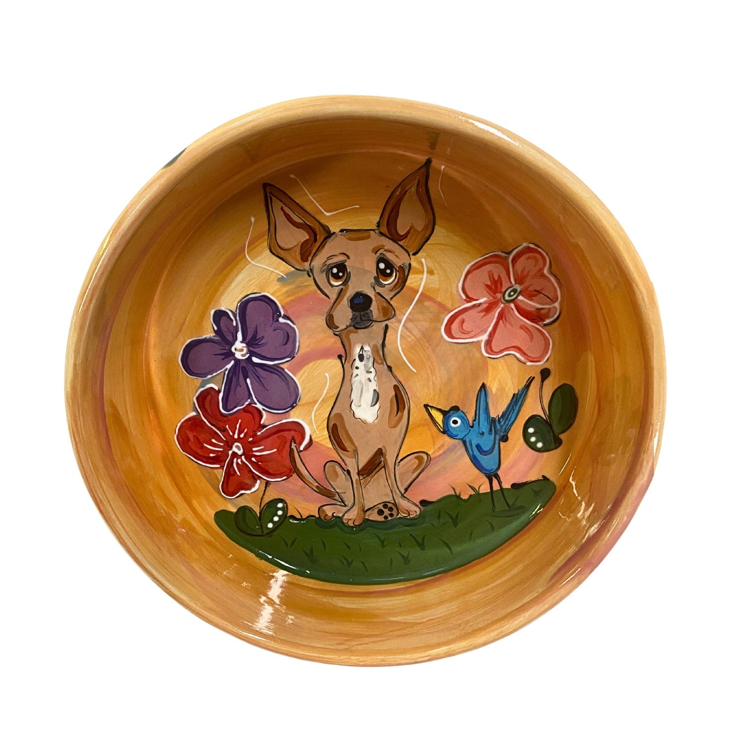 Hand-painted orange ceramic bowl featuring a Chihuahua, colorful flowers, and a blue bird, customizable for pets.