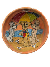 Golden Retriever and Poodle Dog Bowl and Doodle Hanging at the beach