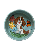 Cavalier King Charles Spaniel in the spring flowers