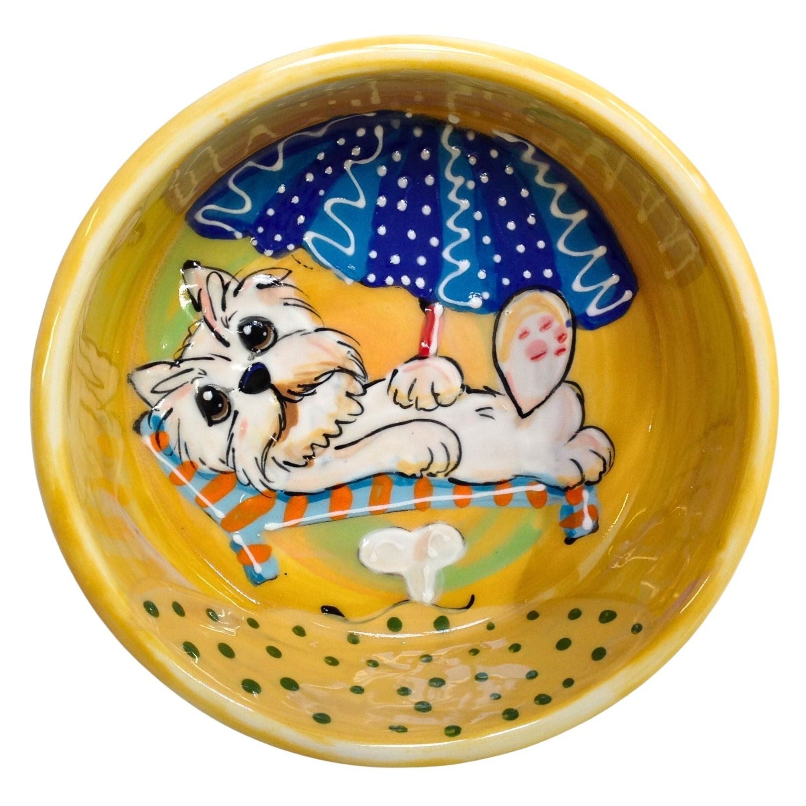 Custom hand-painted West Highland Terrier relaxing under a blue polka-dotted umbrella on a yellow ceramic pet bowl, created by Laguna Beach artist Debby Carman