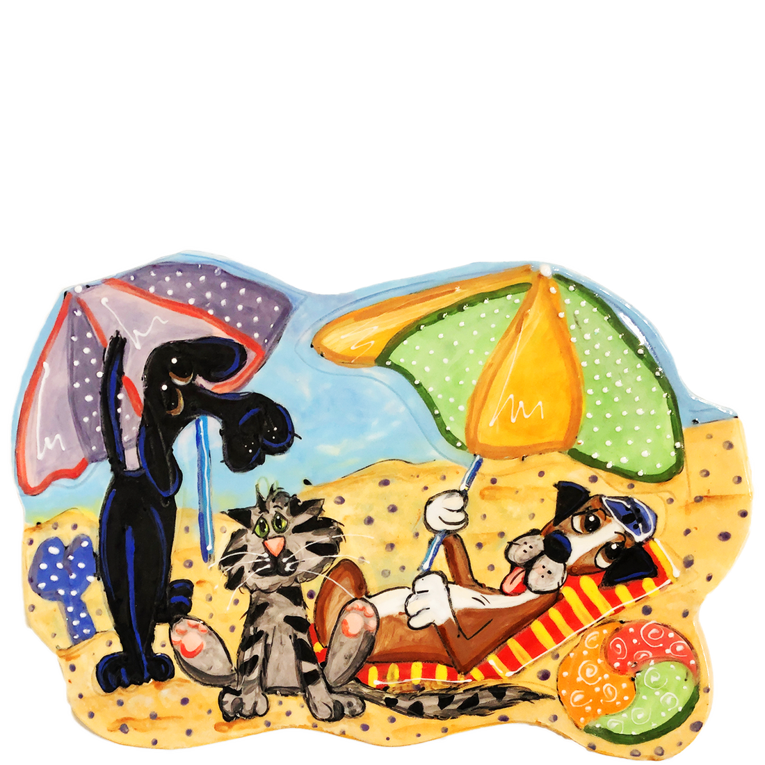 Handcrafted ceramic tile with a hand-painted scene of a dog lounging and a cat playing under beach umbrellas, with intricate details and bright colors, by artist Debby Carman.