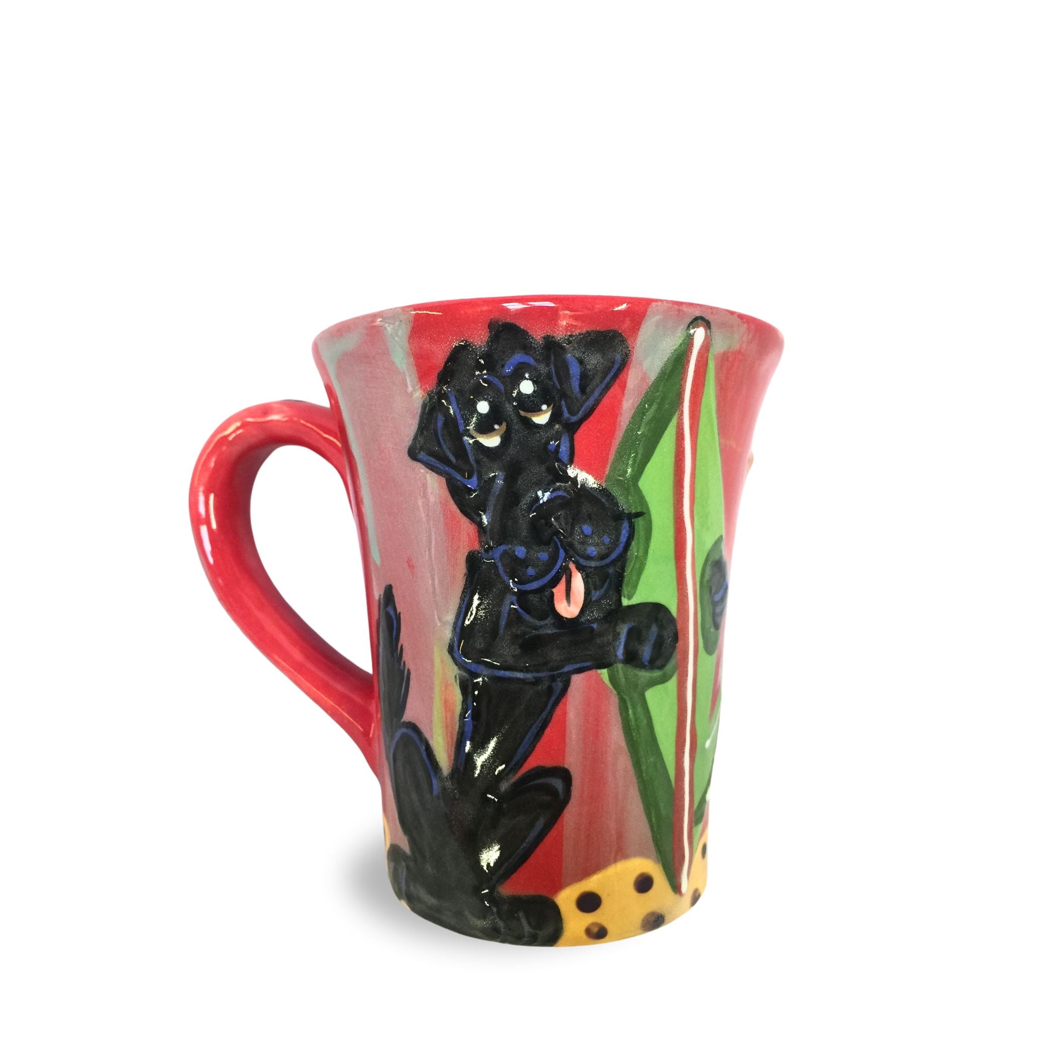 A 12 oz coffee mug with a hand-painted, jubilant Black Labrador and vibrant red handle, set against a colorful background suggestive of beach fun, designed by Debby Carman.