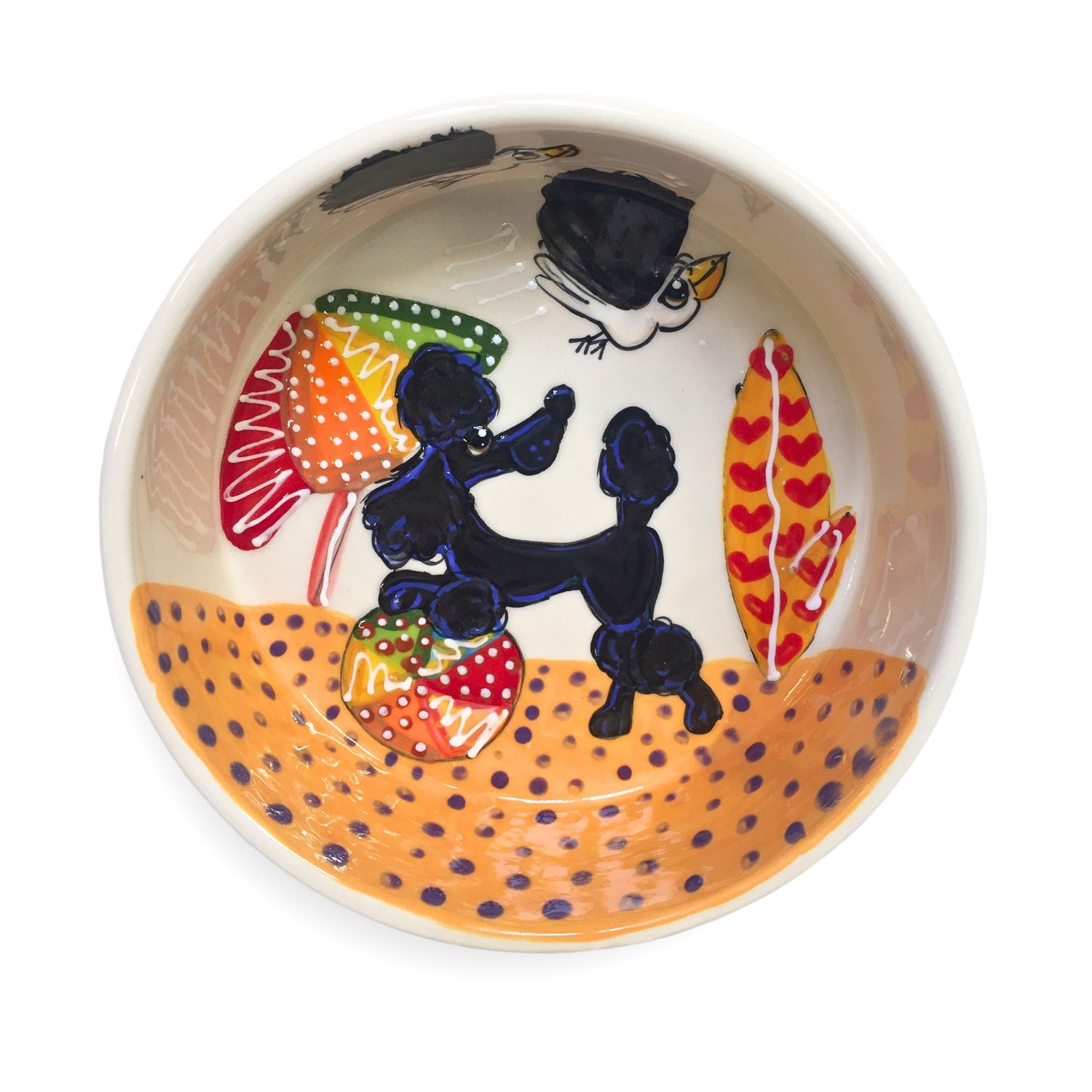 Hand-painted ceramic pet bowl featuring a black poodle design with beach motifs, created by Laguna Beach Artist Debby Carman