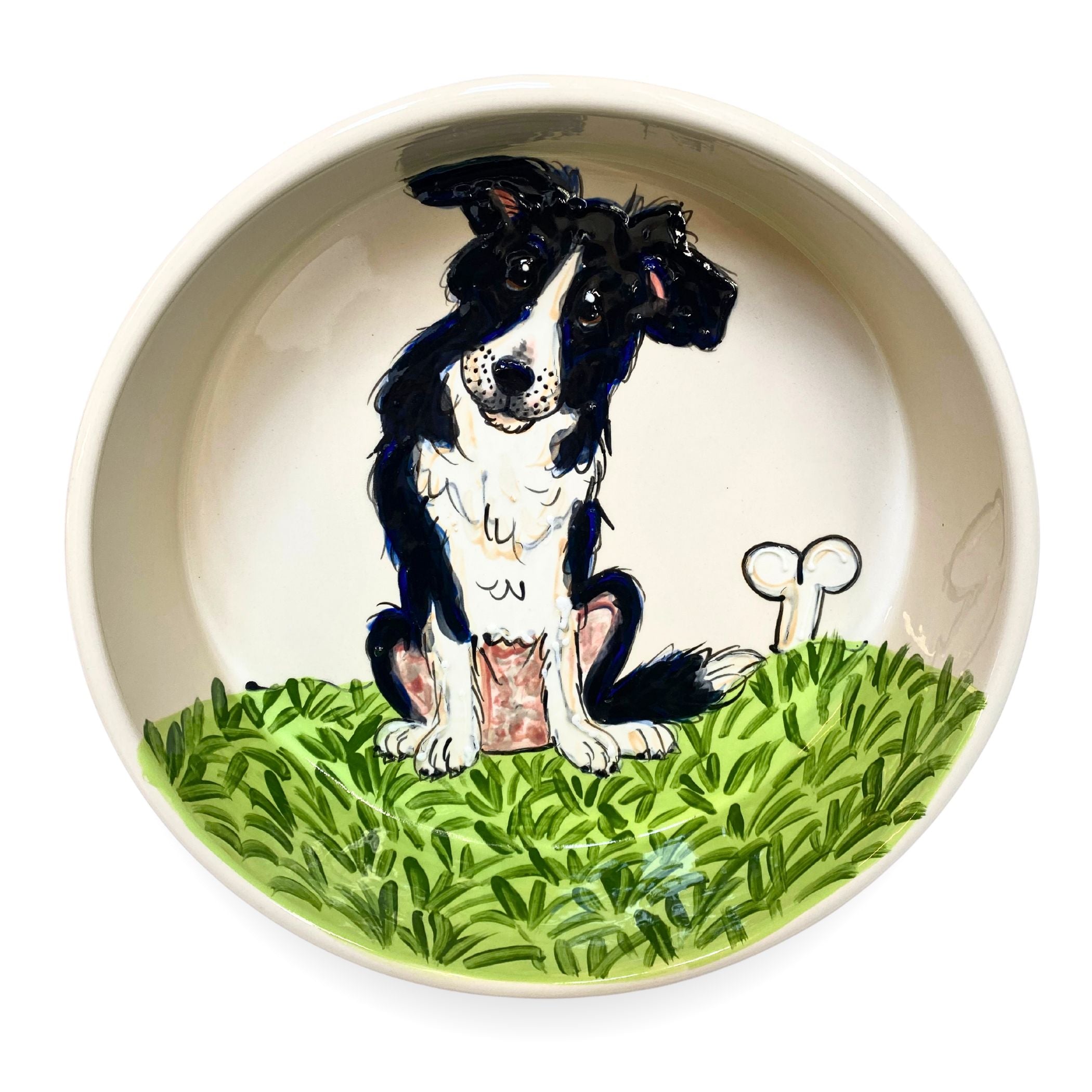 Hand-painted ceramic bowl with a playful Border Collie sitting in a lush green meadow, part of the &quot;Countryside Canine&quot; Collection at FauxPaw.com, ideal for adding a splash of countryside charm to your pet&