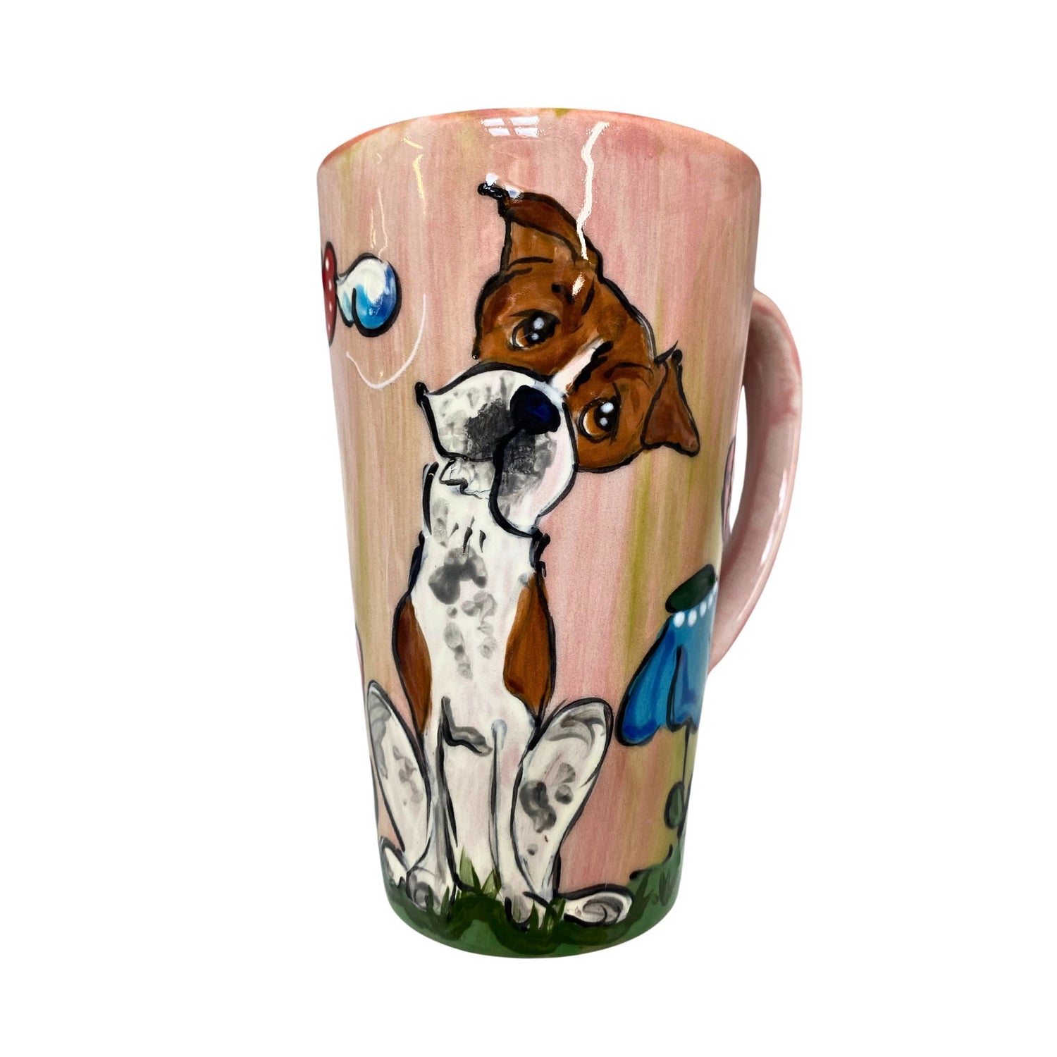 Hand-painted ceramic mug with a whimsical Boxer dog design, vibrant colors on a pastel pink background