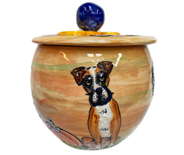Artisanal ceramic treat jar with a hand-painted Boxer portrait, accented by a blue lid knob and yellow rim, evoking the essence of the breed's loyalty and spirit