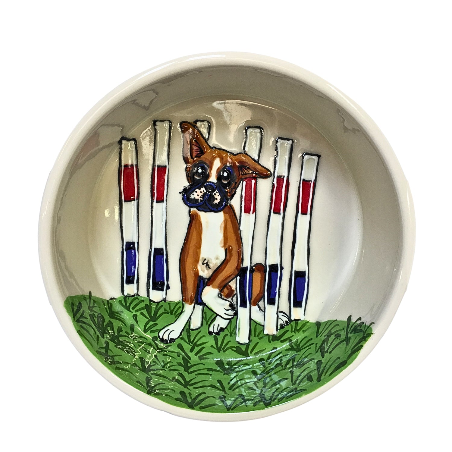 Custom-designed ceramic Boxer bowl with a hand-painted scene of a Boxer in a show stance amid agility poles, highlighting the breed&