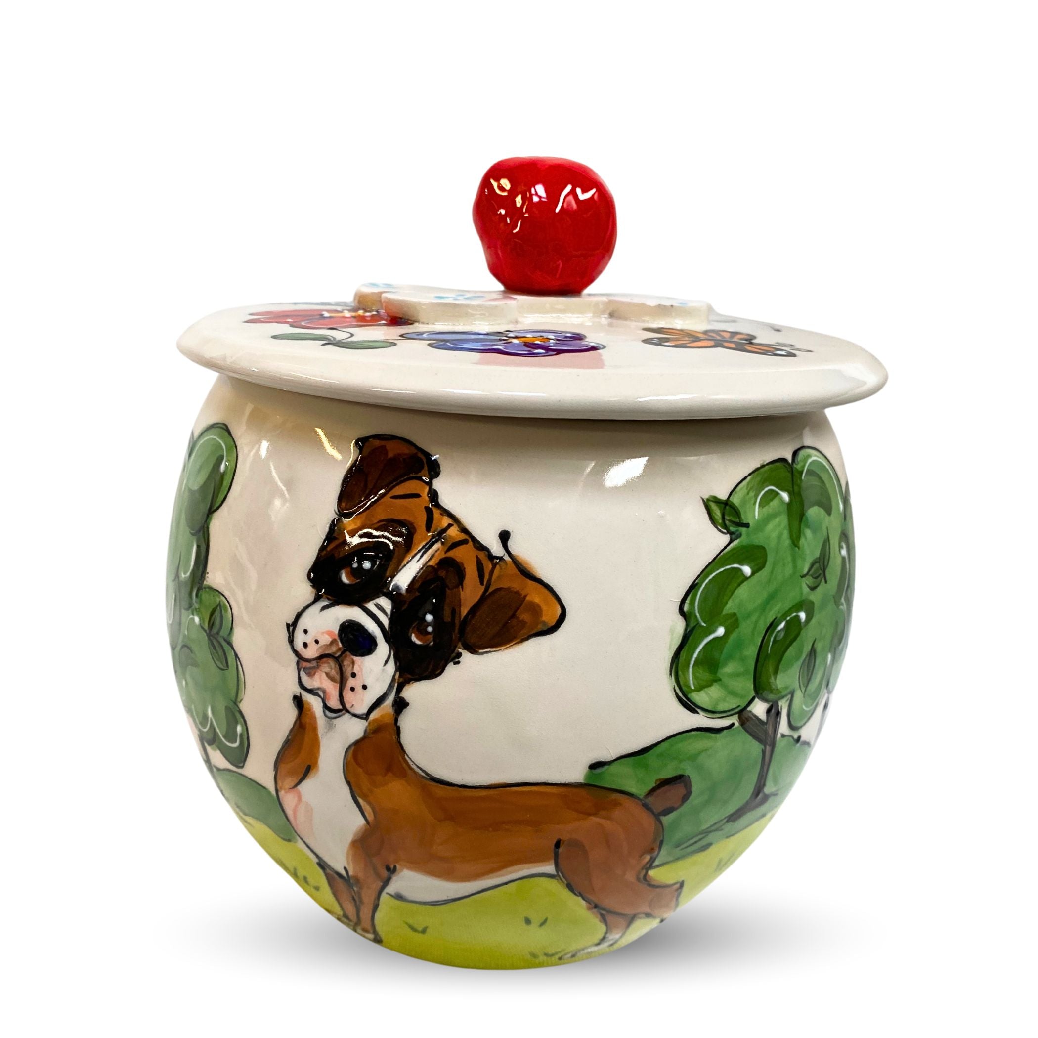 Hand-painted ceramic treat jar featuring a Boxer dog amidst a lush green landscape, a unique trophy by Faux Paw