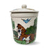 Hand-painted ceramic treat jar featuring a boxer dog and a blue bird in flight against a lush green backdrop, with a snug-fitting lid