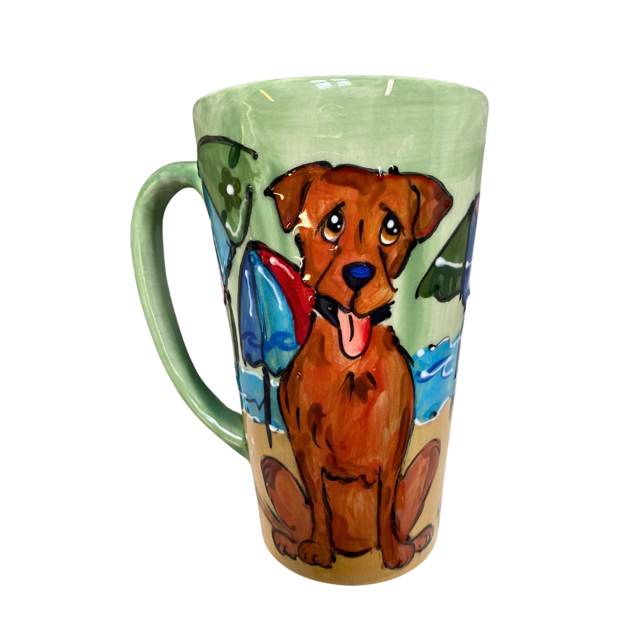 A 16 oz mug painted with a Chocolate Labrador relaxing by the lake, against a soothing green and blue background with a soft green handle, created by Debby Carman.