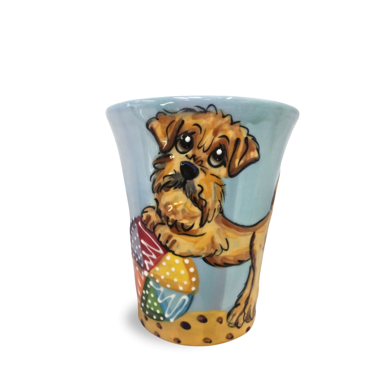 Charming hand-painted espresso mug with a Doodle dog illustration playing with a beach ball on a light blue background, evoking the joy of beach days