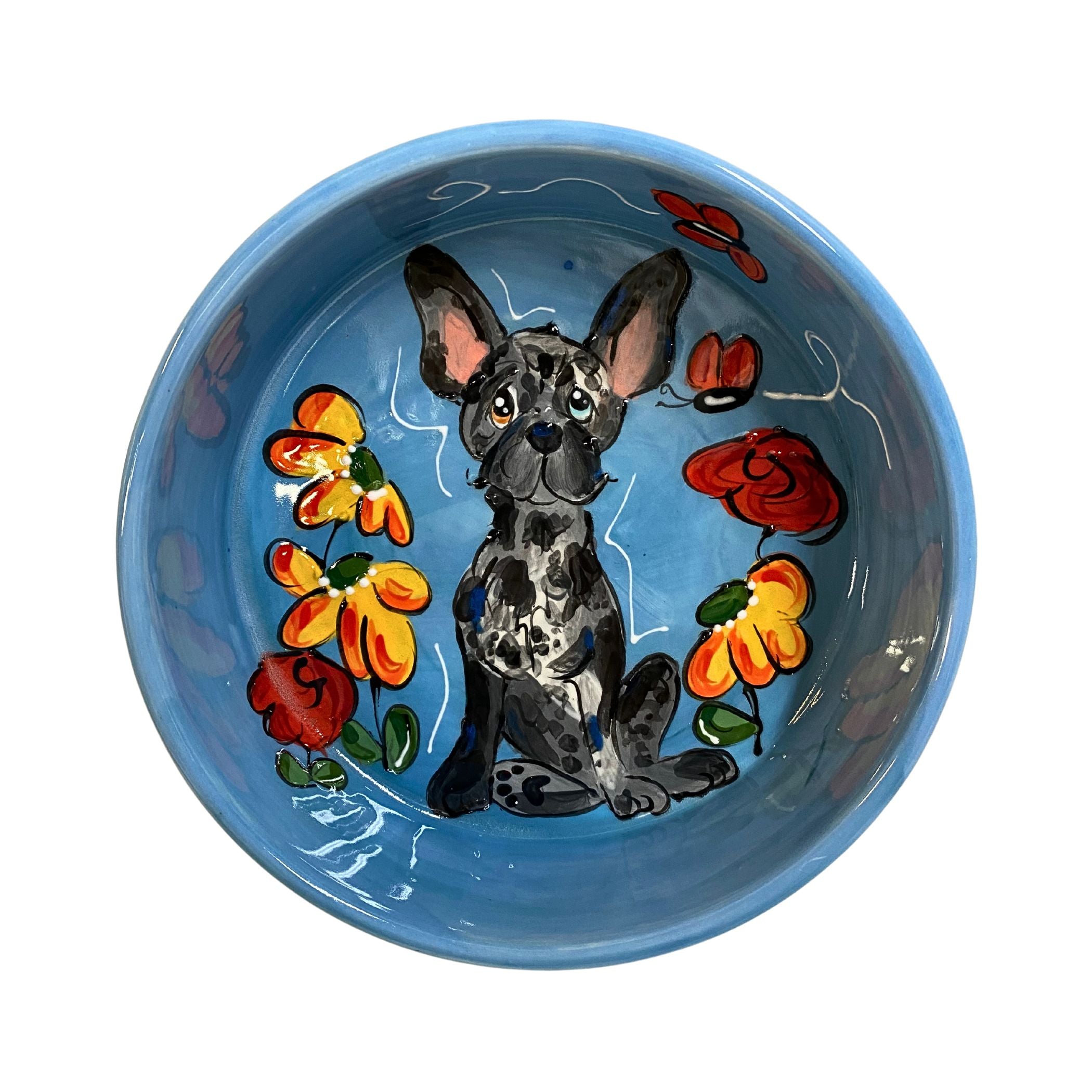 Handcrafted ceramic bowl with a hand-painted French Bulldog and colorful flowers on a blue background, part of the &quot;Petals &amp; Paws&quot; Collection at FauxPaw, perfect for adding a cheerful garden vibe to pet meal times