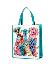 Side view of the 'Rainbow Palz' vinyl tote, highlighting Debby Carman's colorful dog artwork and teal handles.