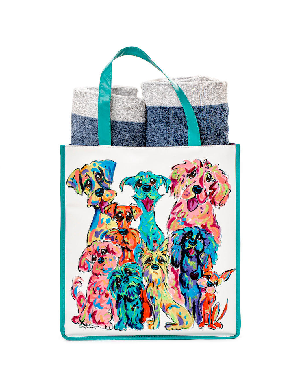 Colorful vinyl tote with teal handles showcasing vibrant artwork of various dog breeds by Debby Carman, filled with folded blue and white towels.