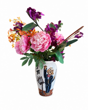 The conductor is in the house 14” vase