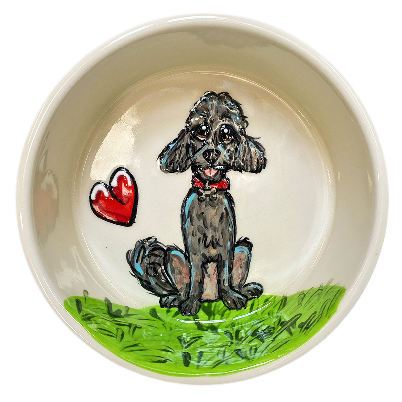 Delicate ceramic bowl with a cream interior, showcasing a hand-painted grey poodle sitting on a lush green grass patch. Beside the poodle is a glossy red heart, symbolizing love and companionship. The poodle, with a red collar, gazes upward with affectionate eyes, inviting a loving atmosphere into any space.