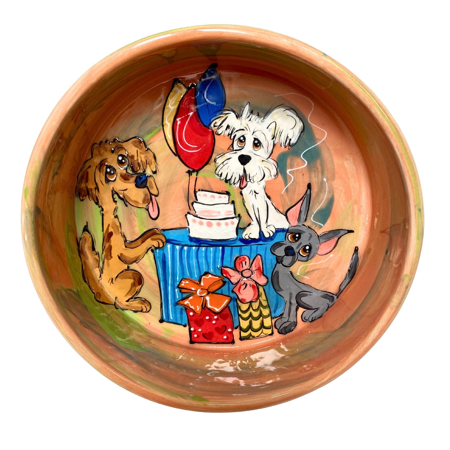 Hand-painted ceramic pet bowl featuring a birthday party scene with a golden retriever, a chihuahua, and a schnauzer around a cake, by artist Debby Carman, customizable and available in two sizes