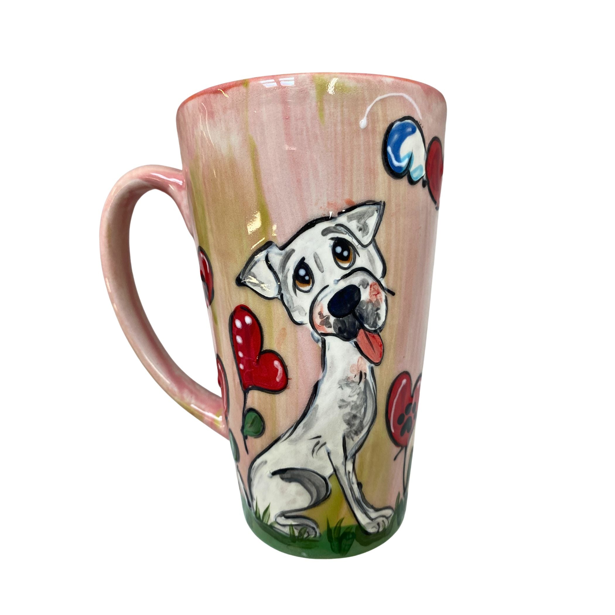 Whimsical White Boxer puppy painted mug with colorful hearts on a soft pink background, ideal for a loving cup of coffee