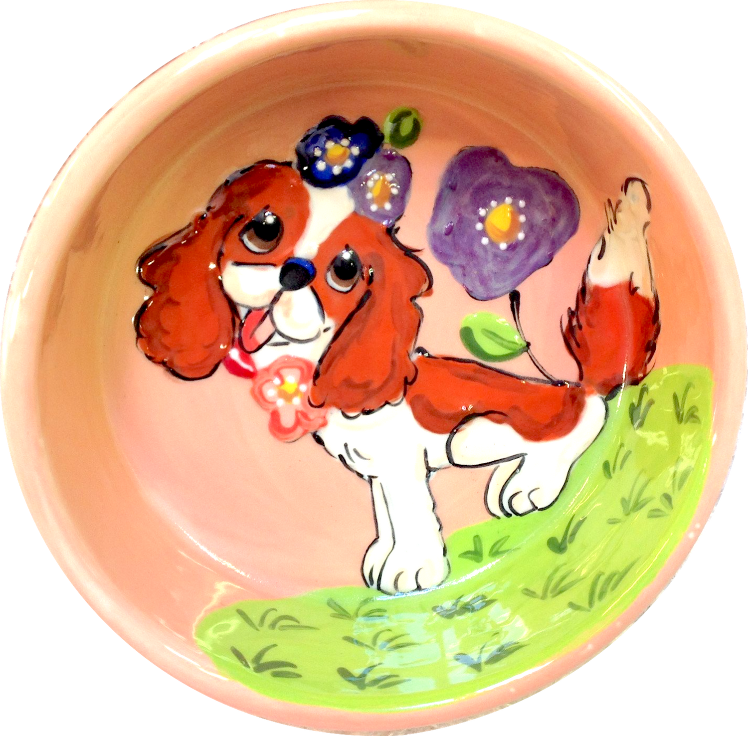 Sweet King Charles sitting in flowers dog bowl