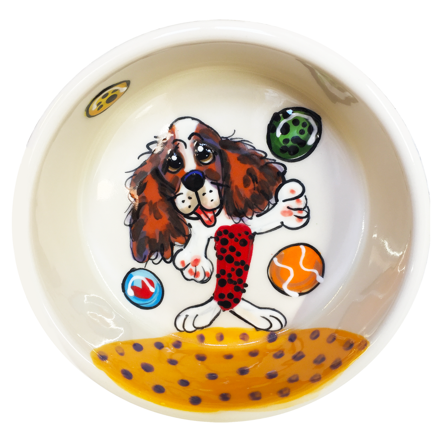 Image of cavalier king charles spaniel playfully ready for fetching tennis balls at the beach hand painted on ceramic pet bowl by faux paw productions artist Debby Carman 