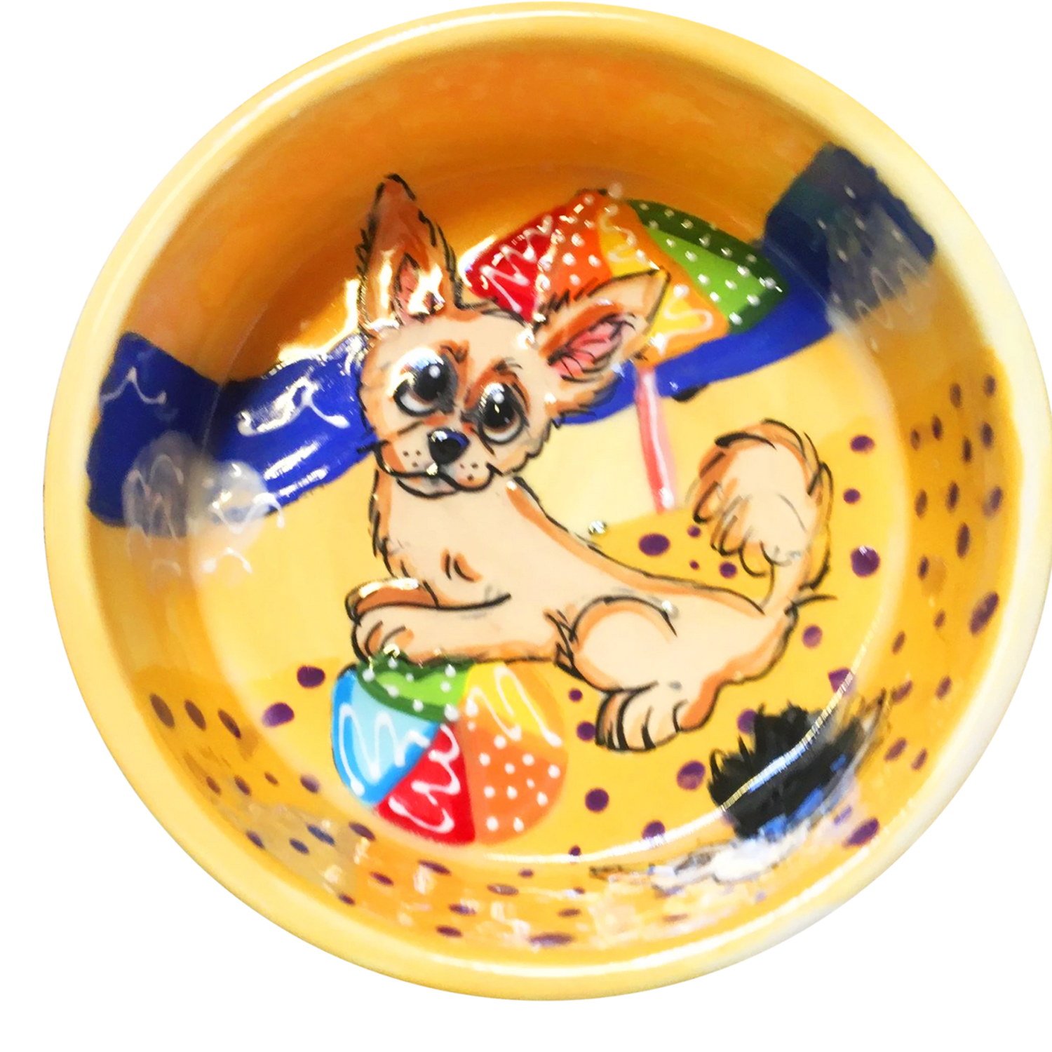 image of chihuahua playing with beach ball on ceramic yellow bowl with beach background hand painted by faux paw artist Debby Carman 