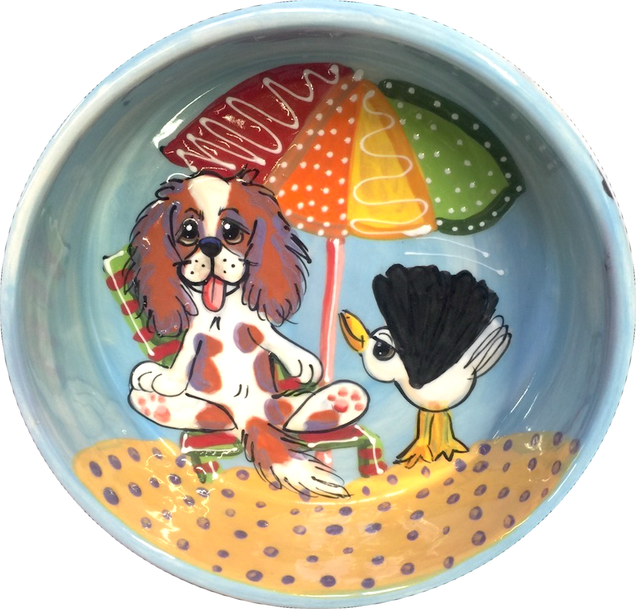 Image of beach lounging cavalier King Charles spaniel soaking up the sun with his seagull friend on light blue background color ceramic pet bowl handmade and hand painted by faux paw productions artist Debby Carman 