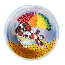 image of cavalier King Charles spaniel lounging happily on the beach handpainted dog bowl by faux paw artist Debby Carman from Laguna Beach on ceramic dog food or water bowl available in various sizes