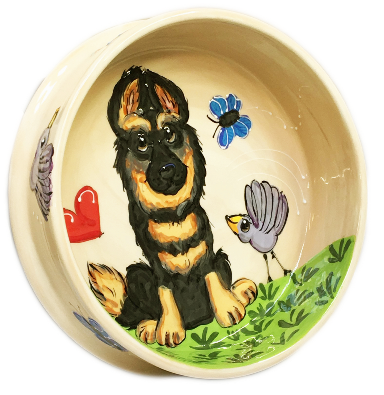 photo of ceramic dog bowl with hand painted German shepherd portrait in a garden setting with hearts, butterflies and birds, by Debby Carman, faux paw petique