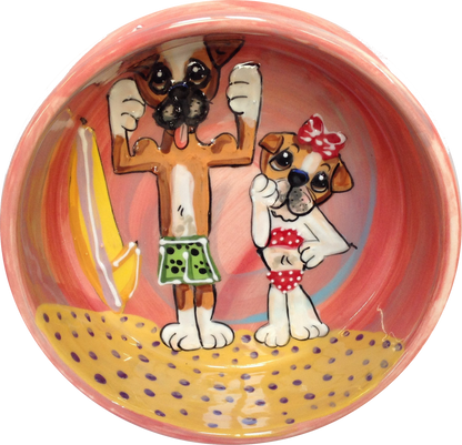 Photo of bulldogs on beach handpainted on ceramic dog food or water bowl by Debby Carman 