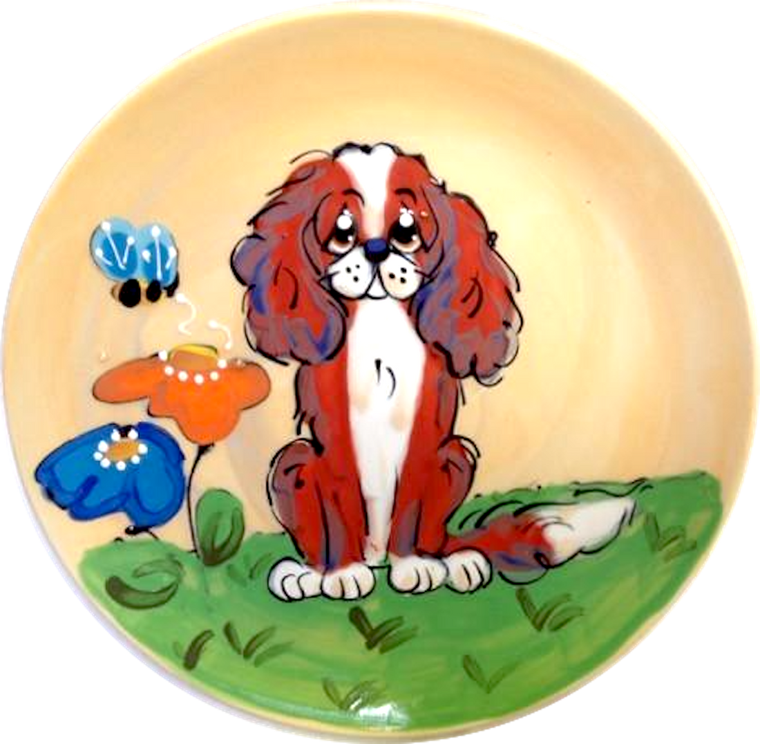 IMAGE OF King Charles Cavalier sitting in flower garden on green grass hand painted by faux paw artist Debby Carman 