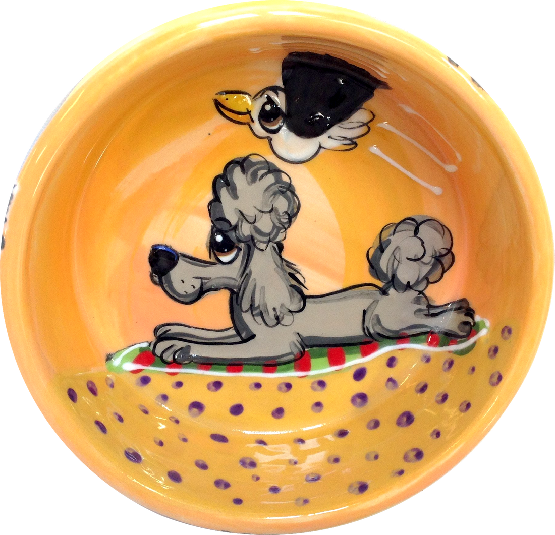 IMAGE OF A GREY POODLE LAYING ON THE BEACH WITH SEAGULL FRIEND FLYING OVER HANDPAINTED ON YELLOW CERAMIC DOG BOWL WITH NAME BY FAUX PAW ARTIST Debby Carman 