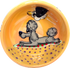 IMAGE OF A GREY POODLE LAYING ON THE BEACH WITH SEAGULL FRIEND FLYING OVER HANDPAINTED ON YELLOW CERAMIC DOG BOWL WITH NAME BY FAUX PAW ARTIST Debby Carman 